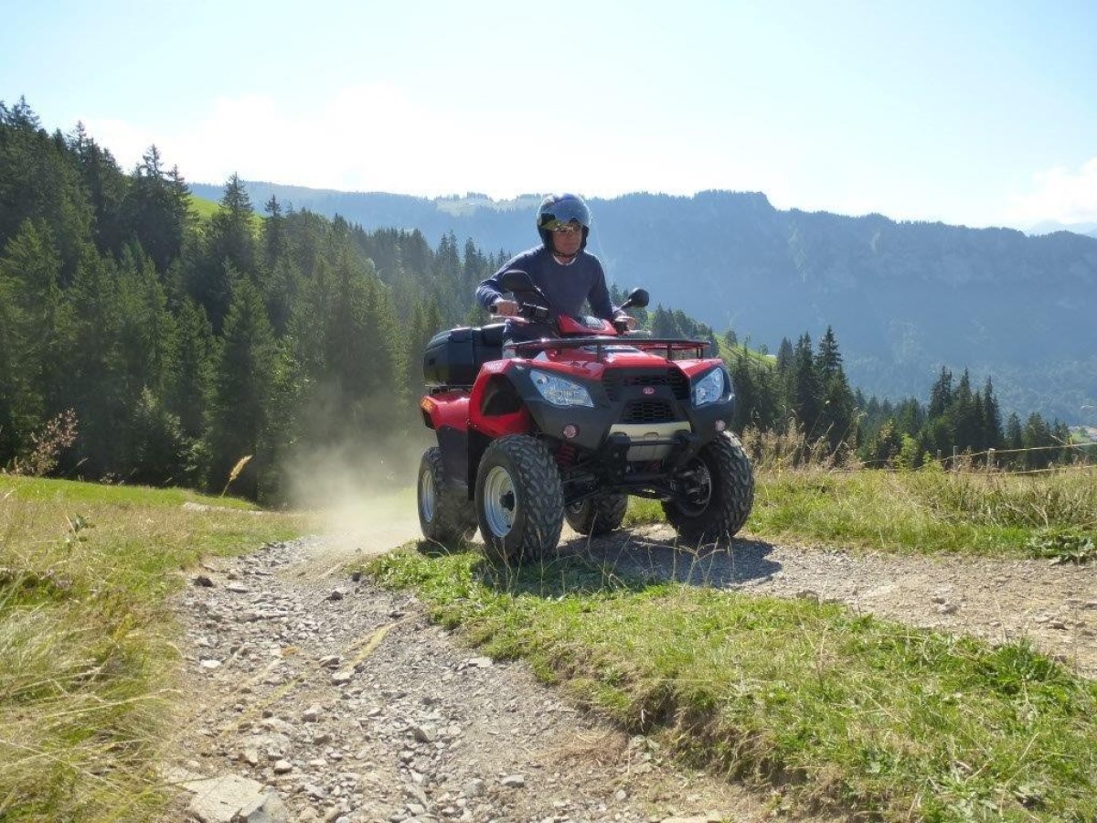 man wearing a blue jersey on a quad