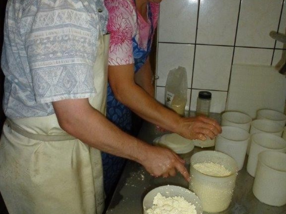 putting cheese in small buckets