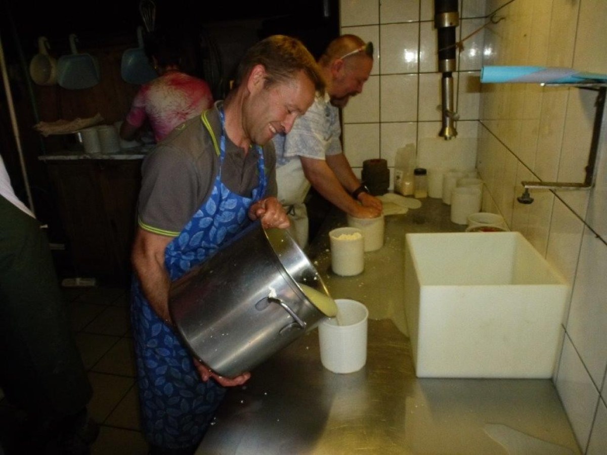 pouring cheese into a bucket