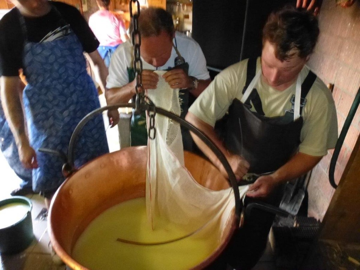 men cooking cheese