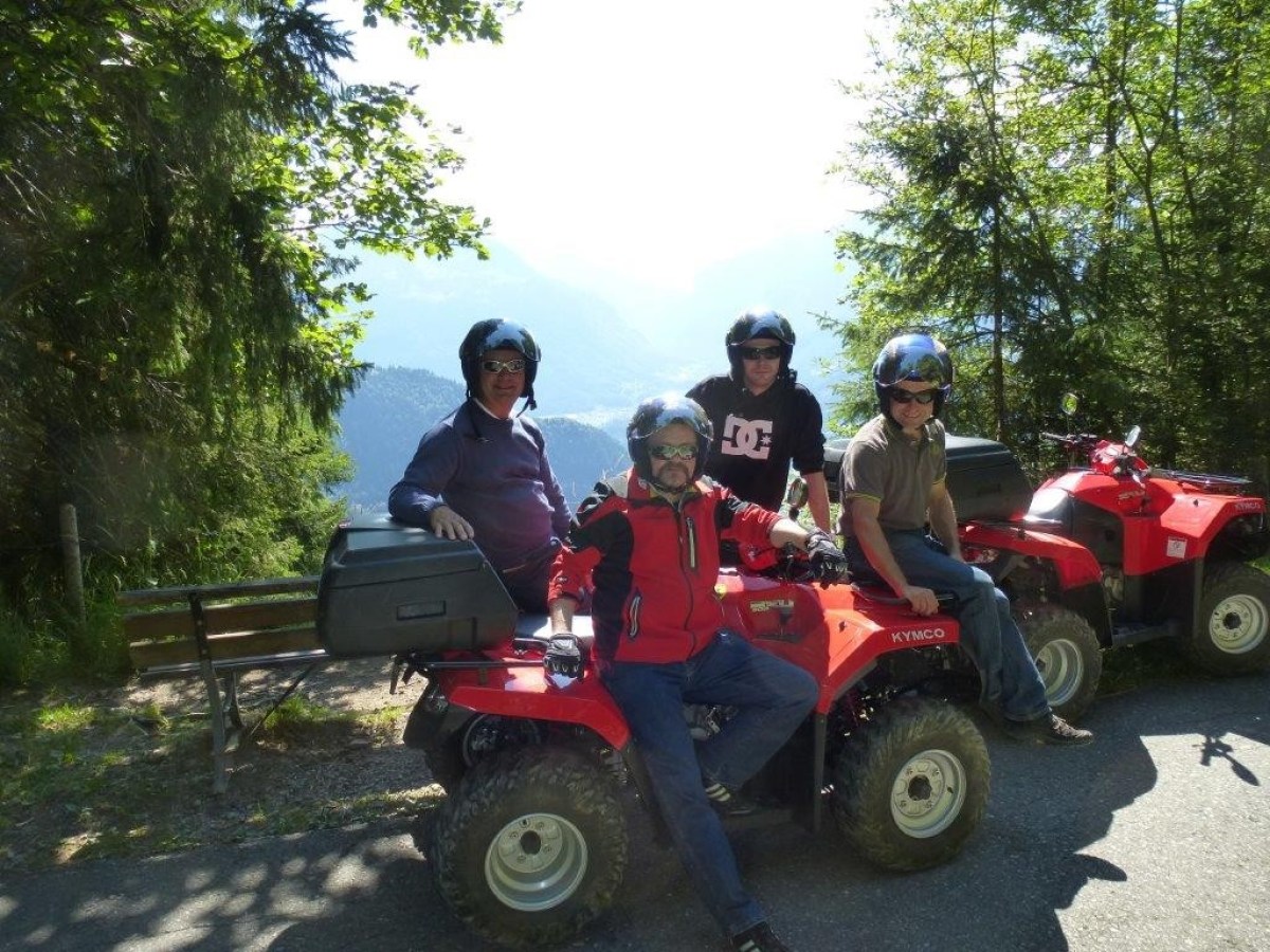 group of 4 men with panoramic views at their backs