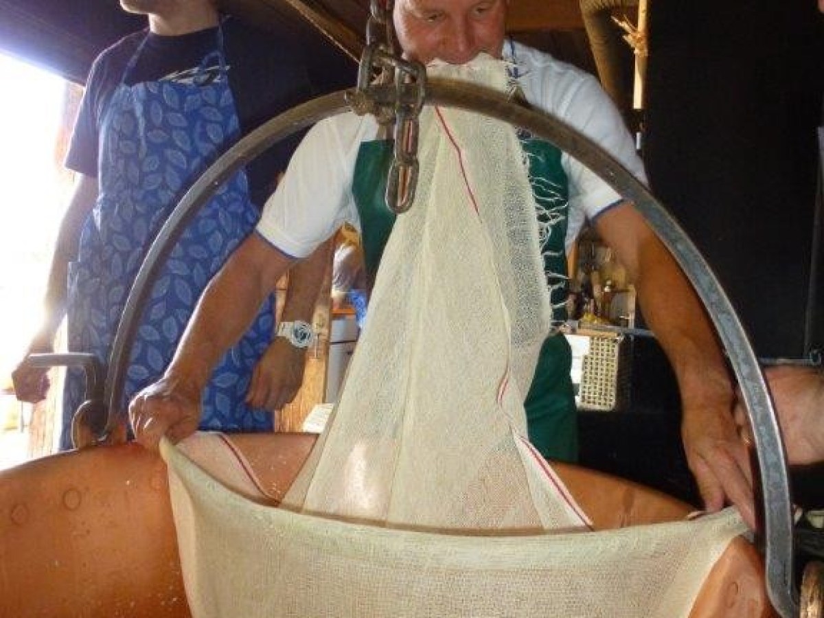 man holding a fabric and putting it into melt cheese