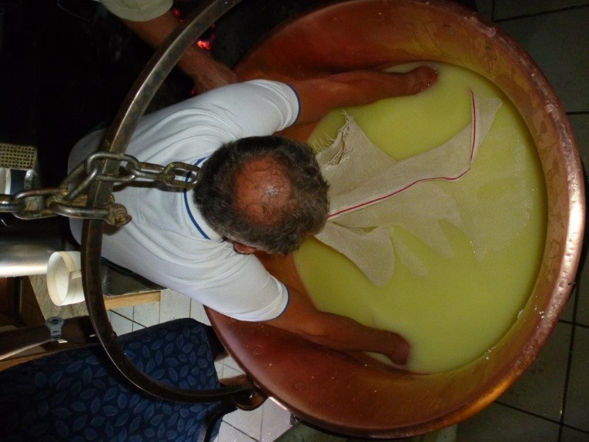 man holding a fabric in the cheese mix