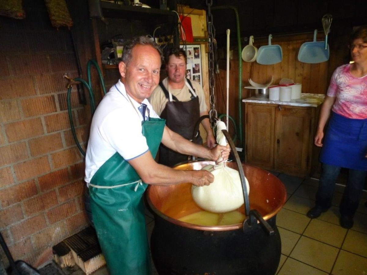 man making a ball filled with cheese
