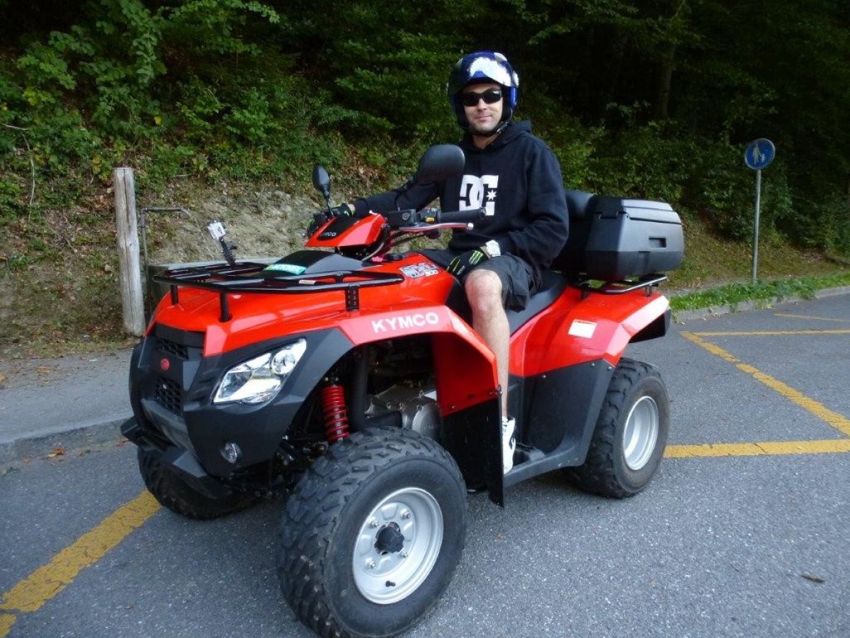 man with a black hoodie on a red quad
