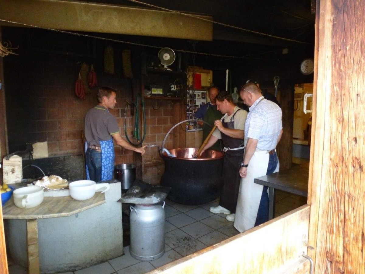 mixing cheese with a big stick