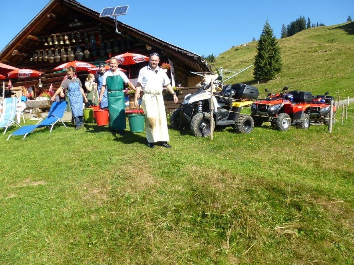 men leaving the cottage with buckets