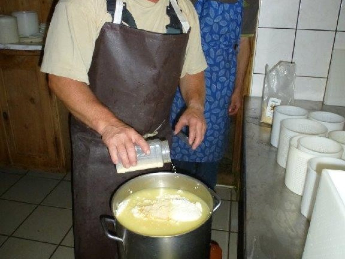 adding some ingredients to cheese