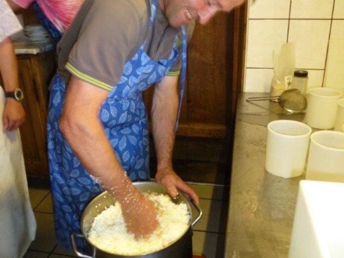 man cooking cheese with his hands