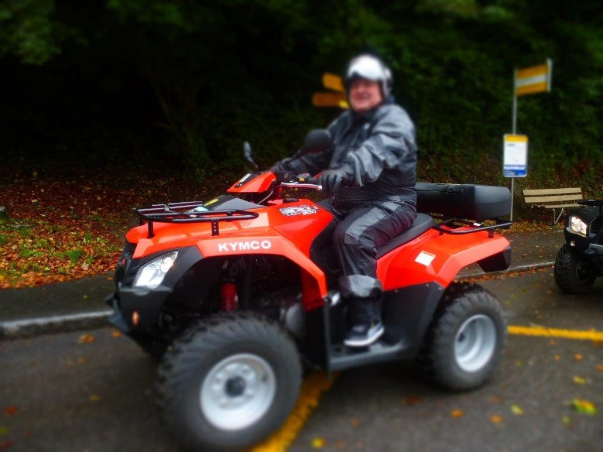man with a black jumpsuit on a red quad