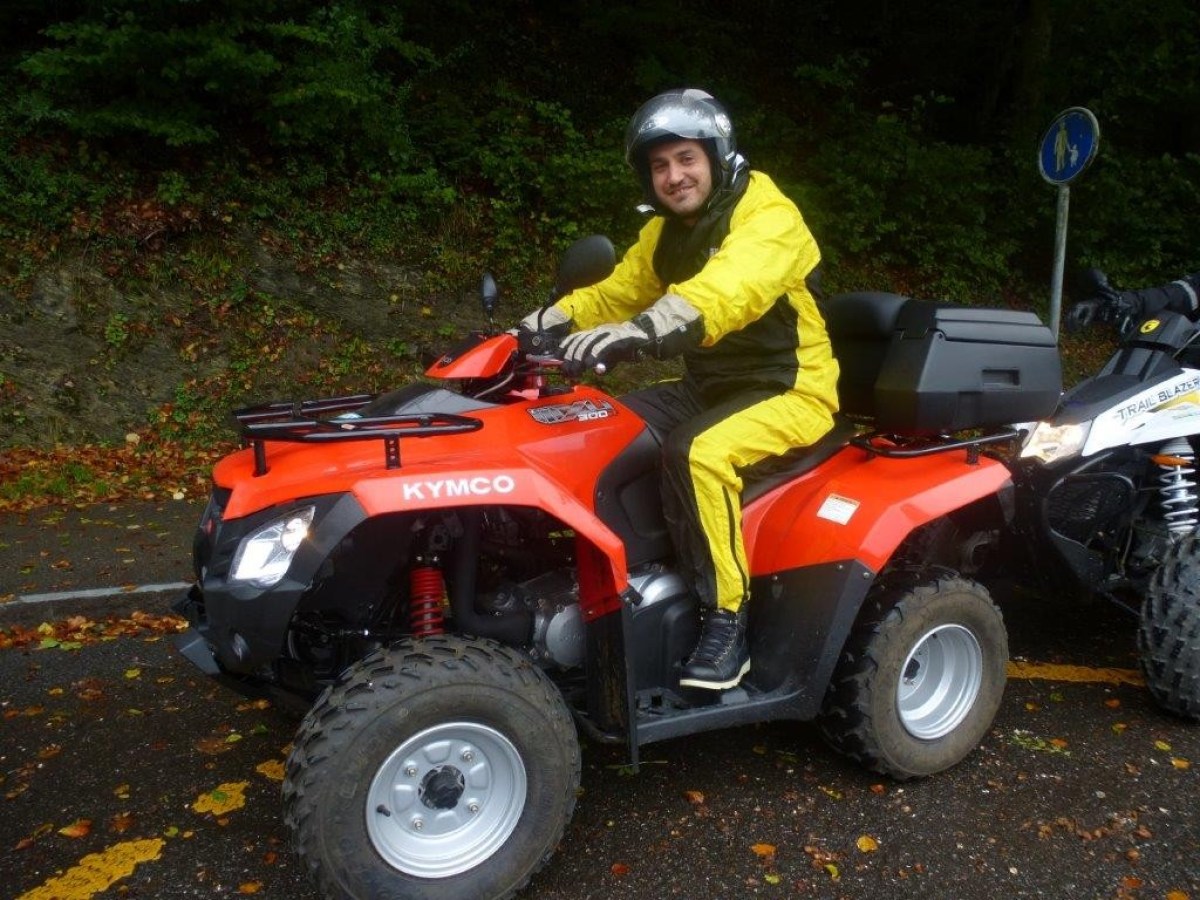 man with a yellow jumpsuit on a quad