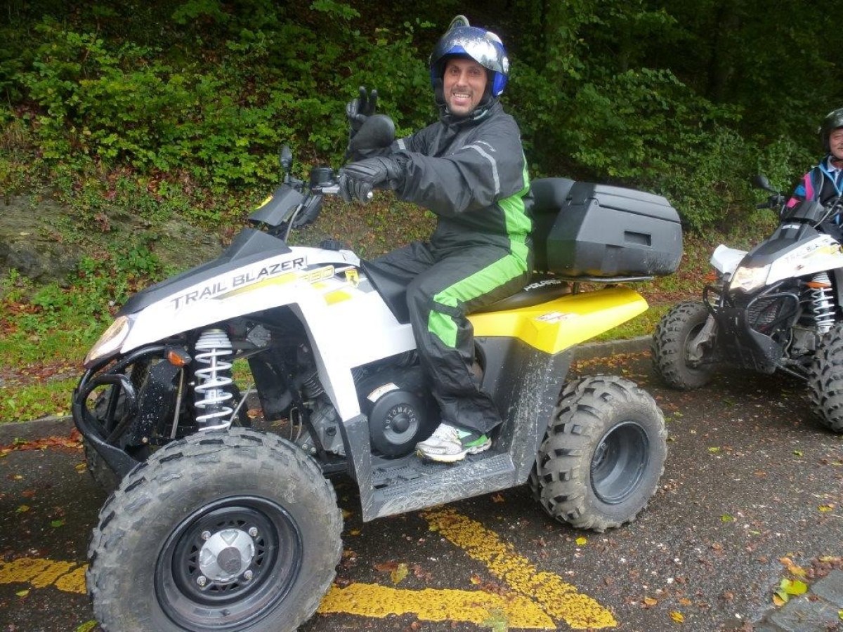man with a green jumpsuit on a quad