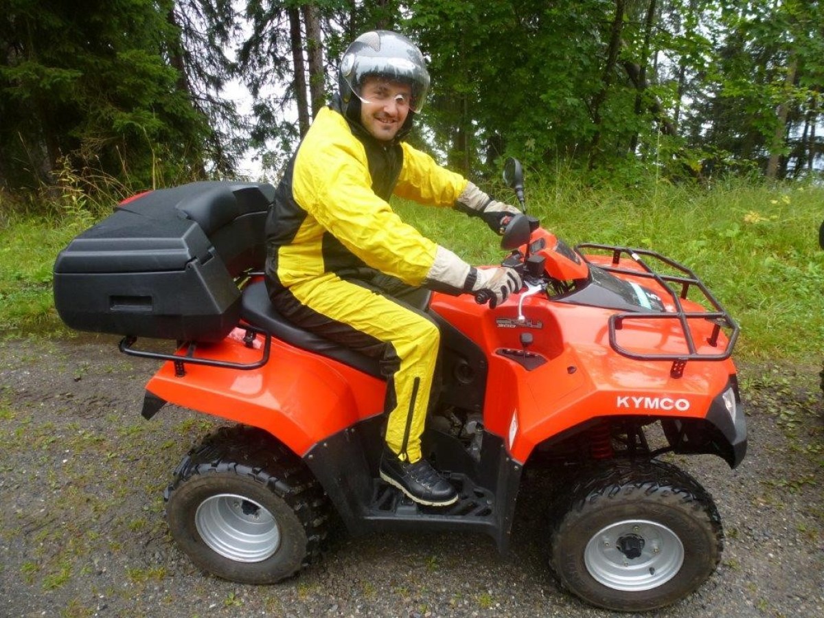 man with a yellow jumpsuit on a quad