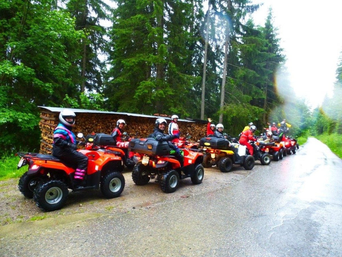 quad tour group waving at the camera