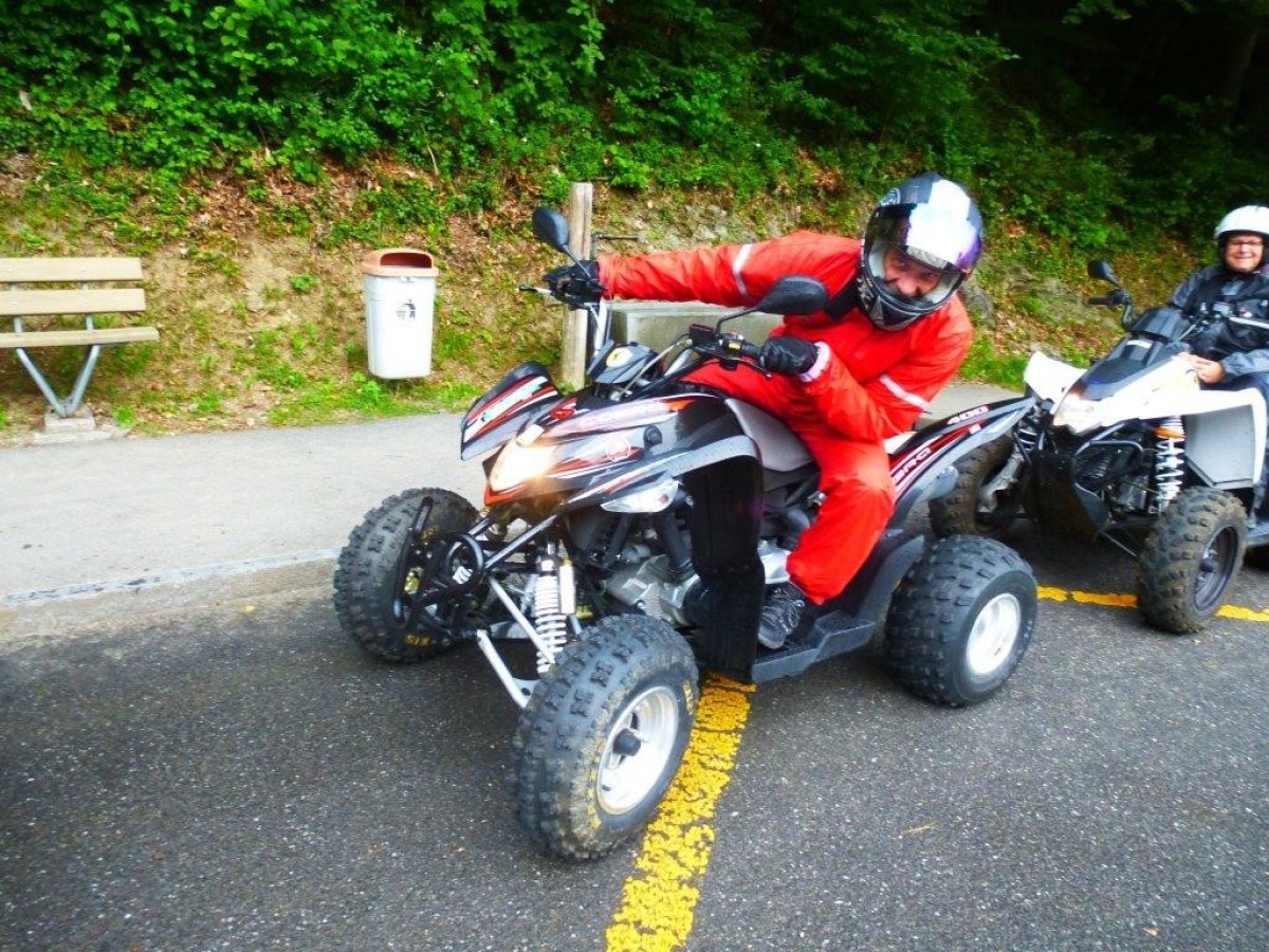 man with a red jumpsuit on a quad