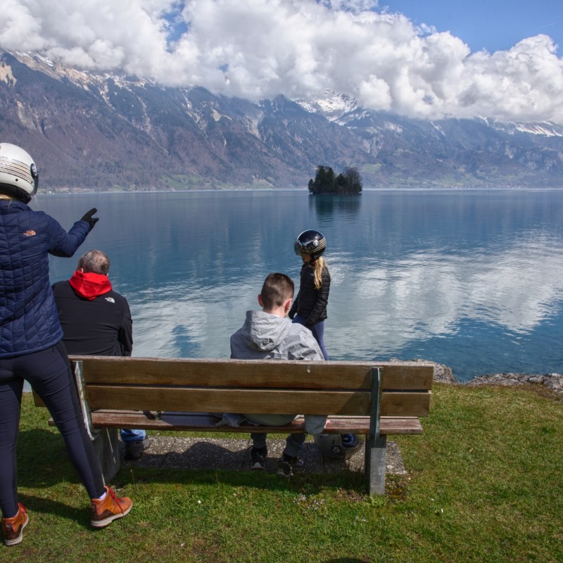 people enjoying the views of a lake