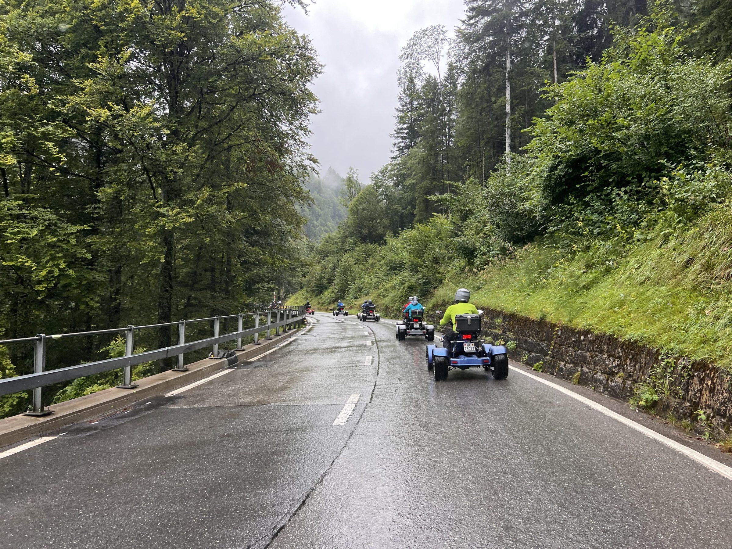 a person riding a motorcycle on the side of a road