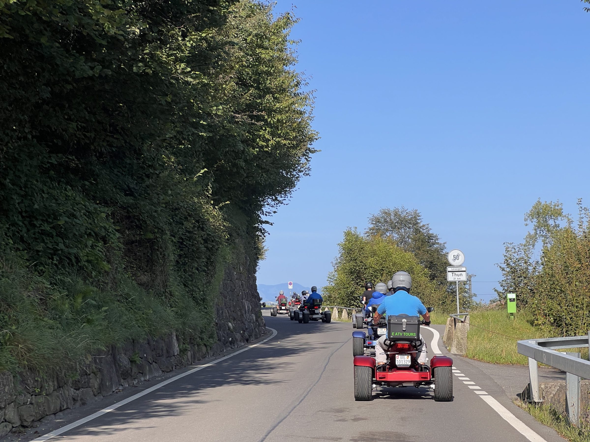 a person riding a motorcycle down a dirt road