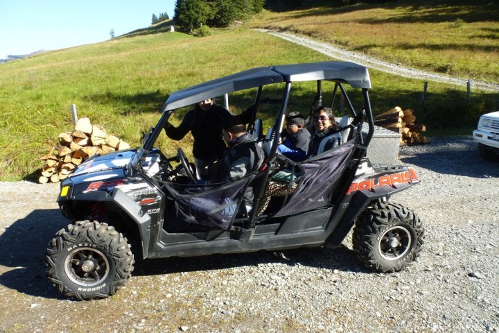 a motorcycle is parked on the side of a dirt road
