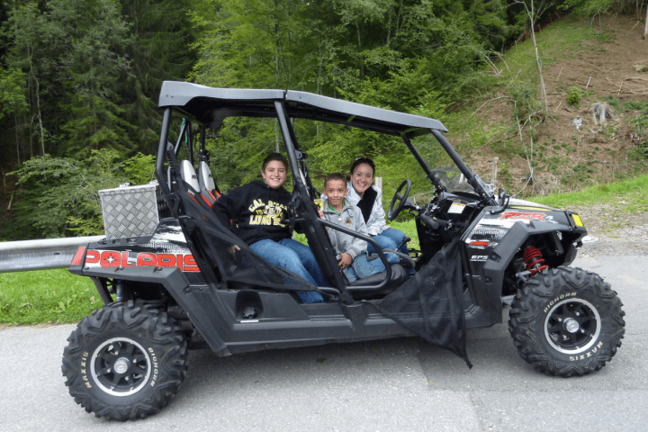 family on a 4x4 during a tour