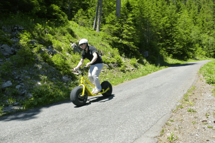 man driving a monster trotti