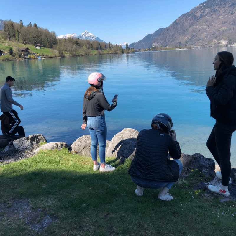 people in front of a lake in Switzerland