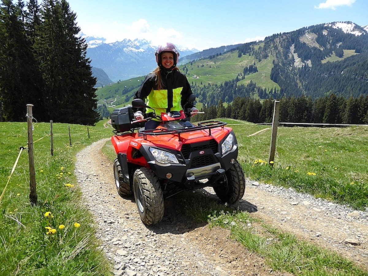 woman on a red quad in Switzerland