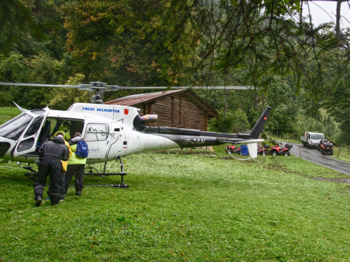 helicopter on a green field