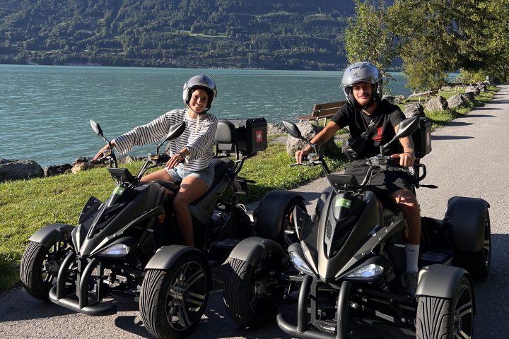 a group of people sitting on a motorcycle