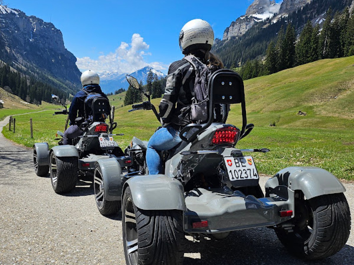 a motorcycle is parked on the side of a mountain