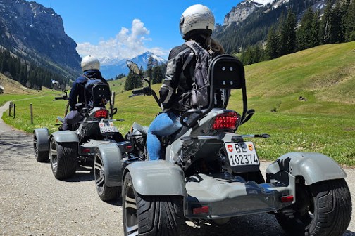 a motorcycle is parked on the side of a mountain