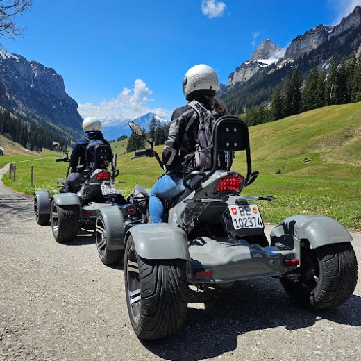 a motorcycle is parked on the side of a mountain