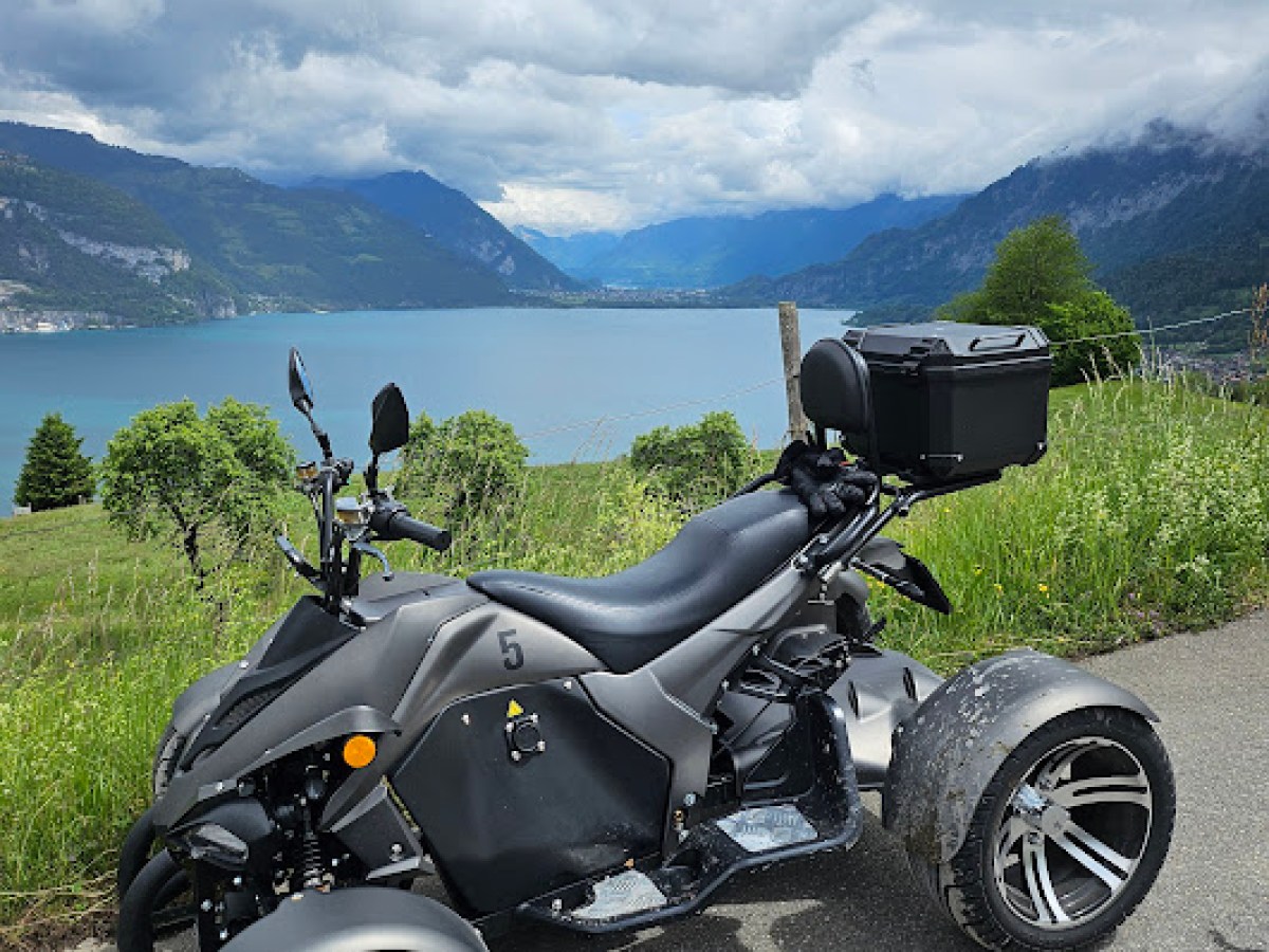 a motorcycle parked on the side of a mountain