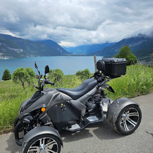 a motorcycle parked on the side of a mountain