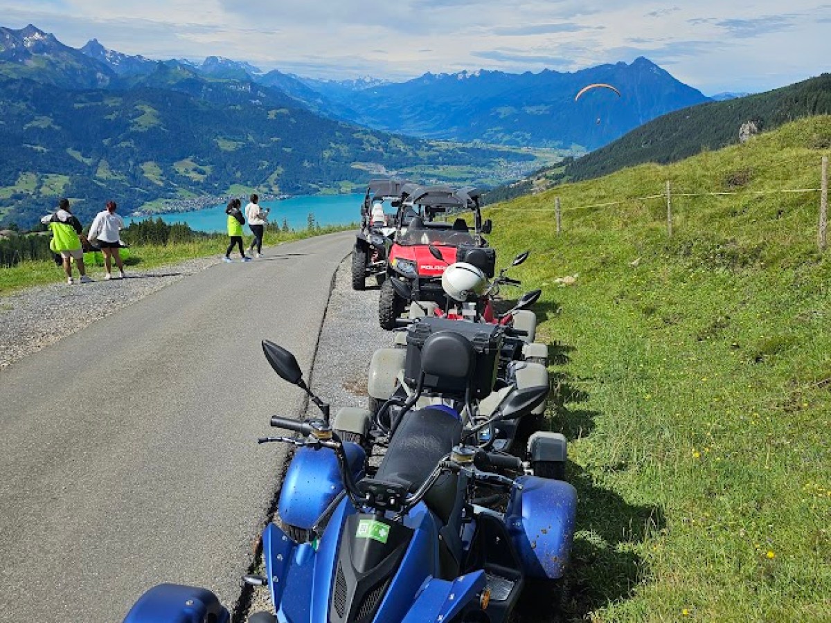 a e atv parked on the side of a mountain
