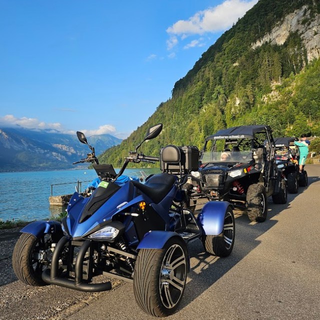 a motorcycle is parked on the side of a mountain